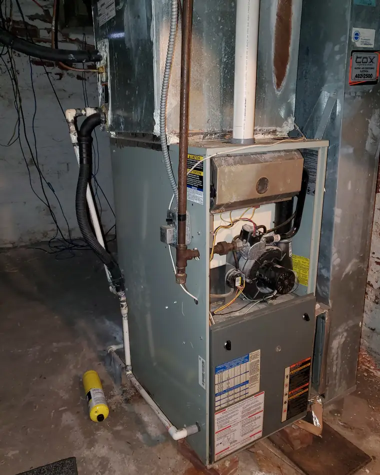 Furnace opened up for diagnosis in a Decatur basement