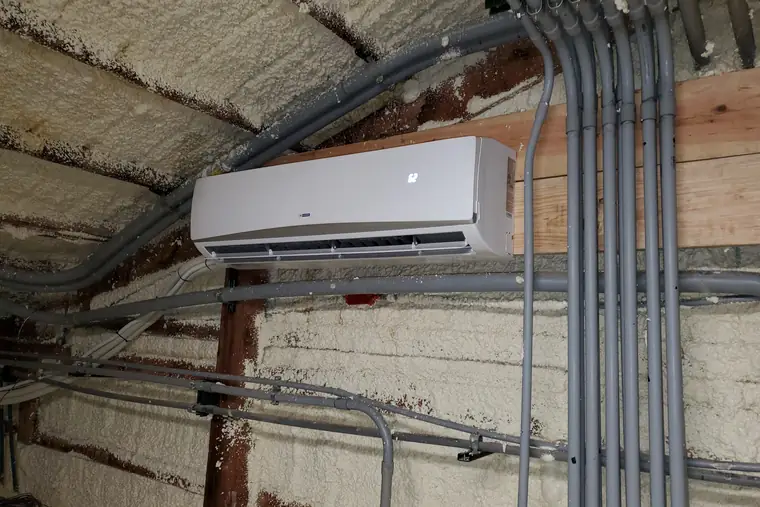 Ductless mini-split fitted in a garage workshop